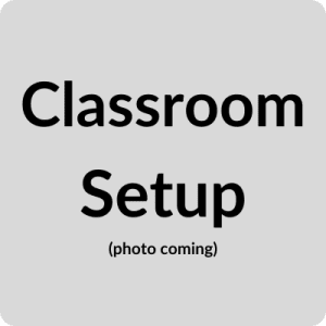 Grey Backgroud. Black text reads "Classroom Setup (photo coming)"