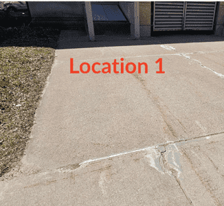 Image of cracked cement drive with text "Location 1"