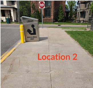 image of Book Drop and sidewalk with text "Location 2"
