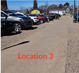 image of sidewalk in a parking lot with text "location 3"